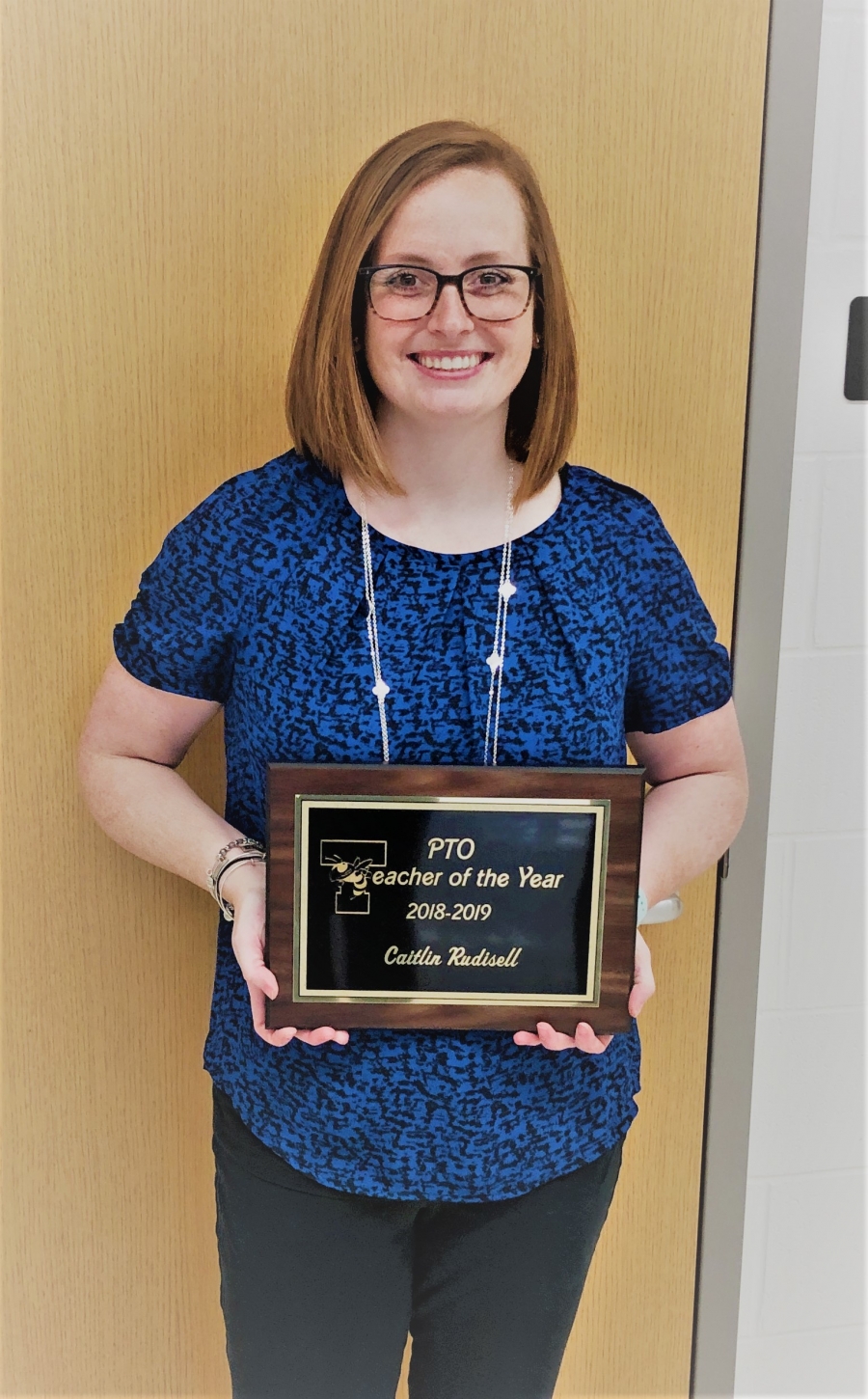 Caitlin Rudisell receives Educator of the Year Award from the PTO